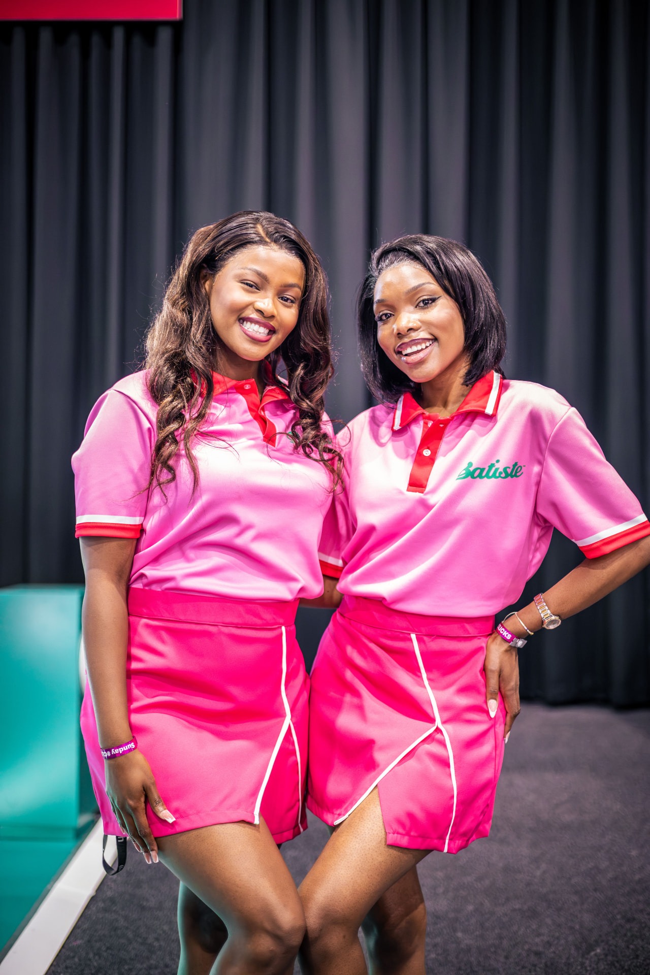 Two Batiste brand ambassadors in matching activation uniforms