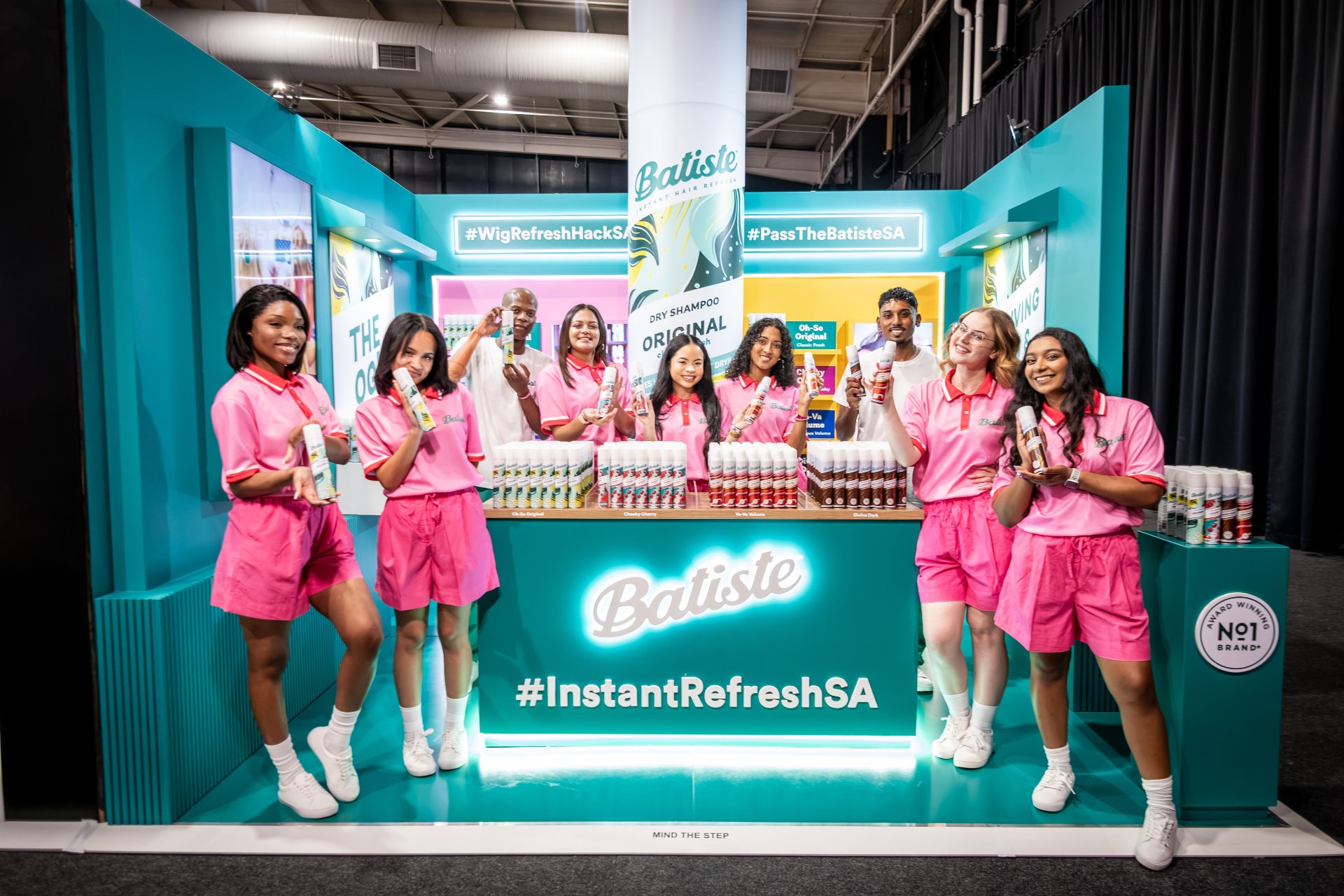 Batiste exhibition stand with brand ambassadors at a beauty expo